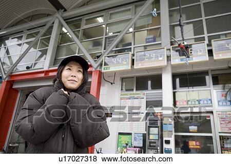 Gas station clerk wearing down jacket View Large Photo Image Stock Photo - Gas station clerk wearing down jacket. Fotosearch