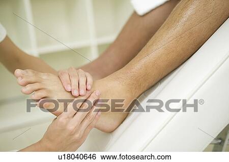 Stock Photograph - Foot massage. Fotosearch