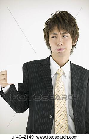 Young businessman gargling View Large Photo Image Stock Photo - Young businessman gargling. Fotosearch