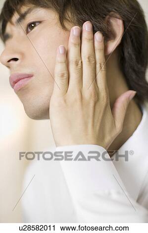 Young businessman worrying about his beards View Large Photo Image Stock Image - Young businessman worrying about his beards. Fotosearch