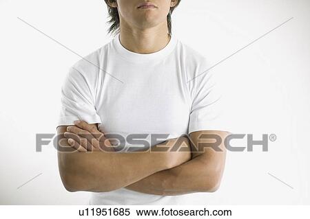 Stock Photography - Young man arms crossed. Fotosearch