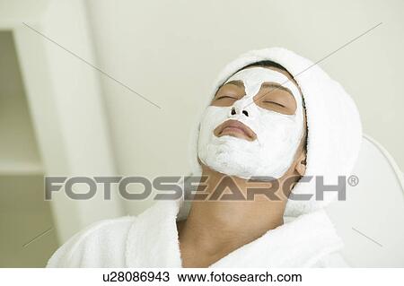 Young man receiving facial pack View Large Photo Image Stock Image - Young man receiving facial pack. Fotosearch