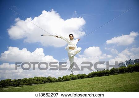 Man practicing martial arts with swords View Large Photo Image Stock Photo - Man practicing martial arts with swords. Fotosearch