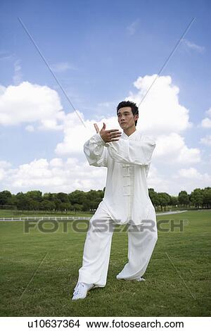 Young man practicing kong fu View Large Photo Image Picture - Young man practicing kong fu. Fotosearch