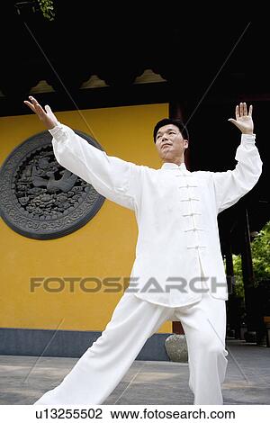 Man doing Tai Chi in Longhua temple View Large Photo Image Stock Image - Man doing Tai Chi in Longhua temple. Fotosearch