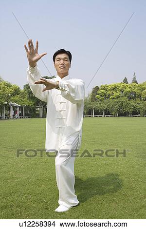 Man doing Tai Chi Outdoors View Large Photo Image Picture - Man doing Tai Chi Outdoors. Fotosearch