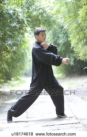 Man doing Tai Chi Outdoors View Large Photo Image Stock Photo - Man doing Tai Chi Outdoors. Fotosearch