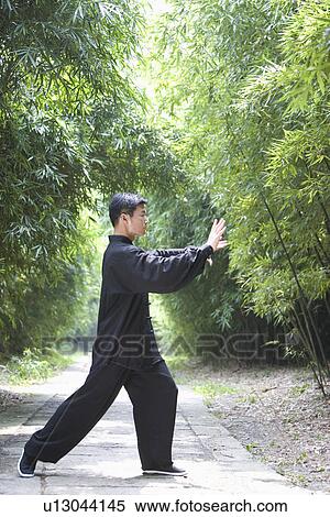 Man doing Tai Chi Outdoors View Large Photo Image Stock Photography - Man doing Tai Chi Outdoors. Fotosearch