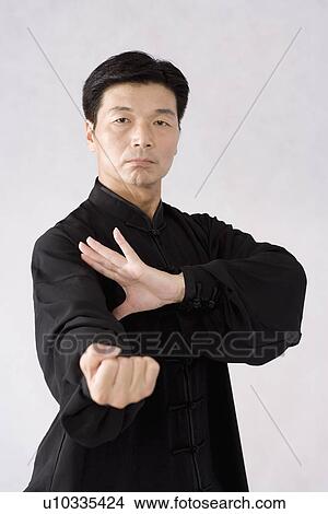 Man practicing Tai Chi View Large Photo Image Picture - Man practicing Tai Chi. Fotosearch