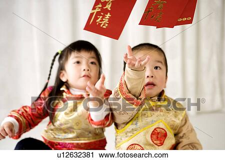 Boy and girl in Chinese traditional clothes View Large Photo Image Stock Image - Boy and girl in Chinese traditional clothes. Fotosearch
