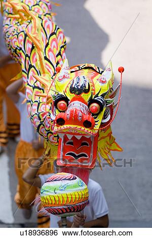 Chinese dragon and handlers View Large Photo Image Stock Photograph - Chinese dragon and handlers. Fotosearch