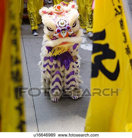 Chinese lion with yellow flags, close-up View Large Photo Image Stock Photo - Chinese lion with yellow flags, close-up. Fotosearch