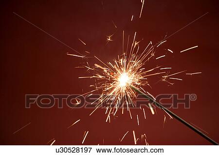 Close-up of a burning sparkler View Large Photo Image Stock Photo - Close-up of a burning sparkler. Fotosearch