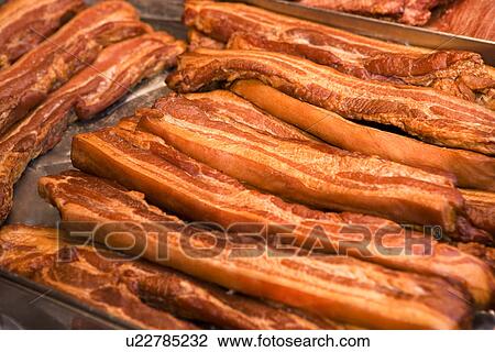 Stock Image - Close-up of preserved sausage. Fotosearch