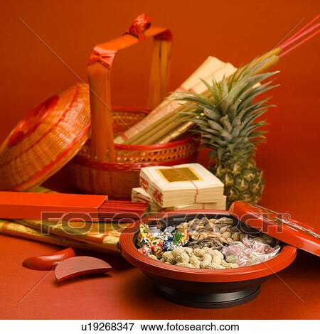 Stock Photo - Wicker basket with incense and fake money. Fotosearch