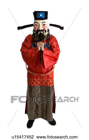 Stock Image - Young man in costume with hands clasped. Fotosearch