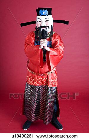 Young man in costume with hands clasped View Large Photo Image Stock Image - Young man in costume with hands clasped. Fotosearch