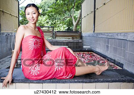 Young woman with sari sitting by pool, looking at camera View Large Photo Image Stock Image - Young woman with sari sitting by pool, looking at camera. Fotosearch