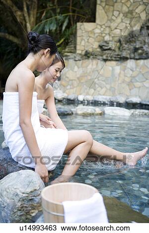 Young women with towel bathing in hot spring, side view View Large Photo Image Stock Image - Young women with towel bathing in hot spring, side view. Fotosearch