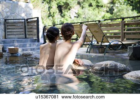 Young women with towel bathing in hot spring, rear view View Large Photo Image Stock Image - Young women with towel bathing in hot spring, rear view. Fotosearch