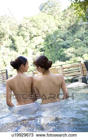 Young women with towel bathing in hot spring, rear view View Large Photo Image Stock Image - Young women with towel bathing in hot spring, rear view. Fotosearch