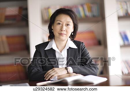 Businesswoman in office View Large Photo Image Stock Image - Businesswoman in office. Fotosearch