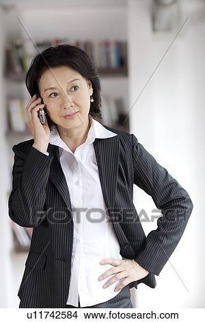 Businesswoman on the phone View Large Photo Image Picture - Businesswoman on the phone. Fotosearch