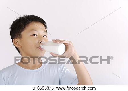 Boy drinking milk, portrait View Large Photo Image Stock Photography - Boy drinking milk, portrait. Fotosearch