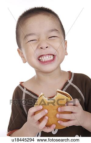 Boy holding sweet food View Large Photo Image Picture - Boy holding sweet food. Fotosearch