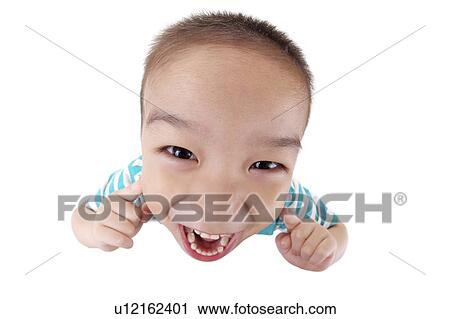 Boy making a face, portrait, close up View Large Photo Image Stock Image - Boy making a face, portrait, close up. Fotosearch