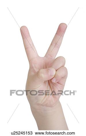 Stock Image - Boy making peace sign, close-up. Fotosearch