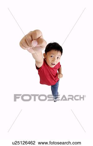 Stock Image - Boy punching the air, portrait, close up. Fotosearch