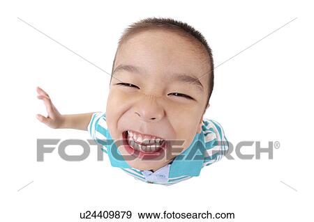 Stock Photo - Boy smiling, high angle view, portrait, close-up. Fotosearch