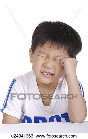Boy with head in hand, portrait View Large Photo Image Stock Image - Boy with head in hand, portrait. Fotosearch