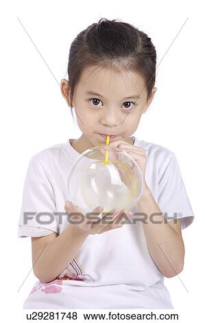 Girl blowing bubble, portrait View Large Photo Image Stock Photo - Girl blowing bubble, portrait. Fotosearch