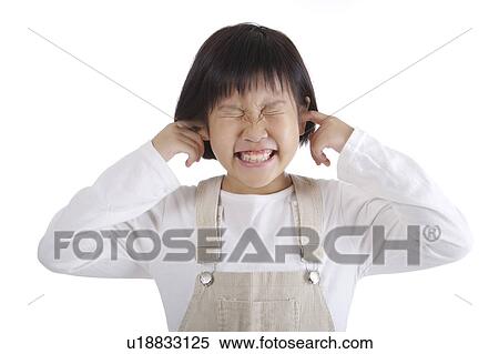 Girl holding fingers in ears, portrait View Large Photo Image Stock Photography - Girl holding fingers in ears, portrait. Fotosearch