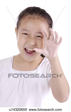 Girl making a face, portrait View Large Photo Image Stock Photo - Girl making a face, portrait. Fotosearch