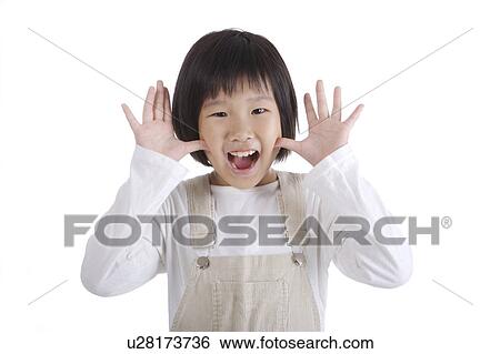Stock Photograph - Girl making face, portrait. Fotosearch