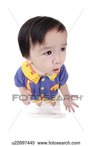 Girl standing on chair, portrait View Large Photo Image Stock Photography - Girl standing on chair, portrait. Fotosearch