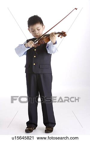 Boy (6-8) practicing on violin View Large Photo Image Stock Image - Boy (6-8) practicing on violin. Fotosearch