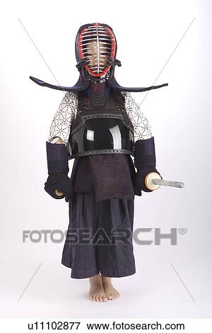 Boy in kendo uniform holding fencing foil View Large Photo Image Stock Photo - Boy in kendo uniform holding fencing foil. Fotosearch