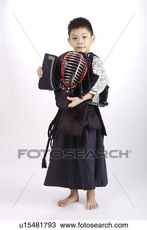 Boy wearing kendo uniform holding fencing mask, portrait View Large Photo Image Stock Image - Boy wearing kendo uniform holding fencing mask, portrait. Fotosearch