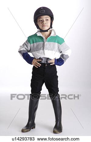 Boy wearing sports helmet and boots, portrait View Large Photo Image Stock Image - Boy wearing sports helmet and boots, portrait. Fotosearch