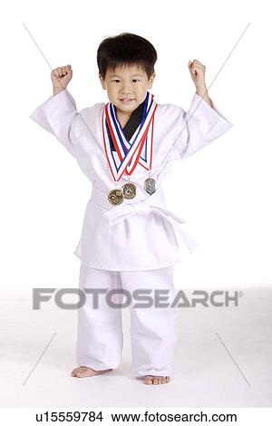 Picture - Boy with taekwondo medals, portrait. Fotosearch