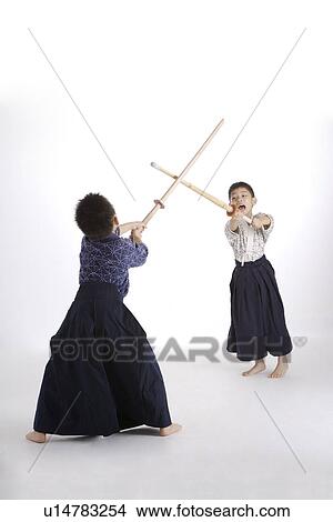 Picture - Boys practicing kendo, portrait. Fotosearch
