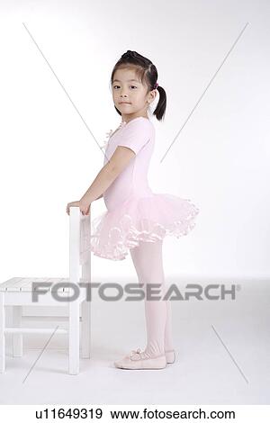 Girl ballet dancing with chair, side view, portrait View Large Photo Image Stock Photo - Girl ballet dancing with chair, side view, portrait. Fotosearch