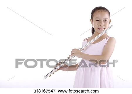 Girl blowing flute, smiling, portrait View Large Photo Image Stock Photo - Girl blowing flute, smiling, portrait. Fotosearch