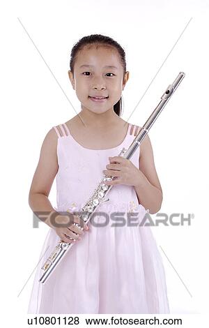 Stock Photo - Girl holding flute, portrait. Fotosearch