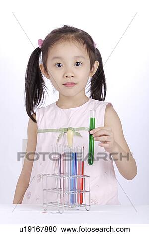 Girl holding test tube, portrait View Large Photo Image Stock Image - Girl holding test tube, portrait. Fotosearch