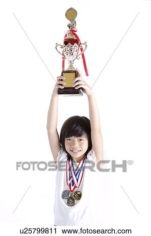 Girl lifting trophy, portrait View Large Photo Image Stock Image - Girl lifting trophy, portrait. Fotosearch